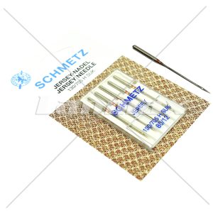 Agulha Ponta Bola. Ao penetrar no material o formato da ponta desvia as fibras evitando o rompimento.